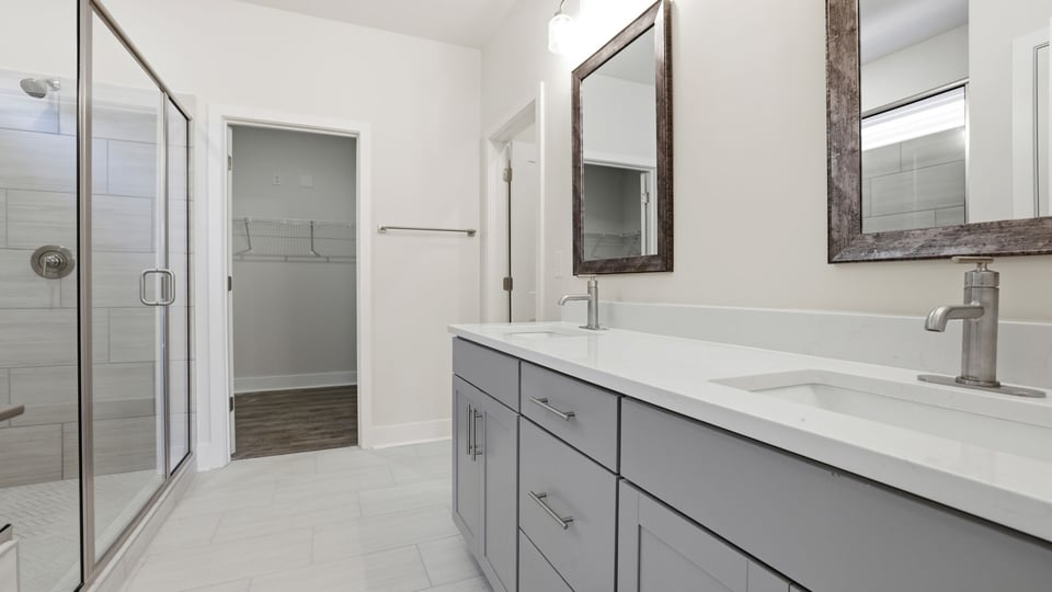 Primary bathroom with double vanity sinks.