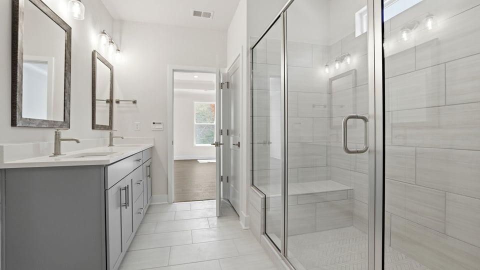 Primary bathroom with double vanity sinks.