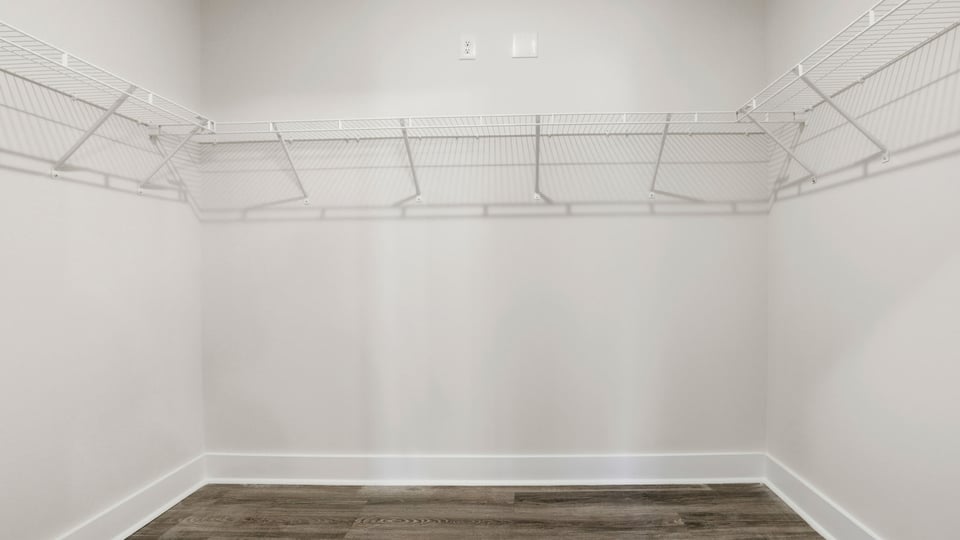 Primary closet with shelf.
