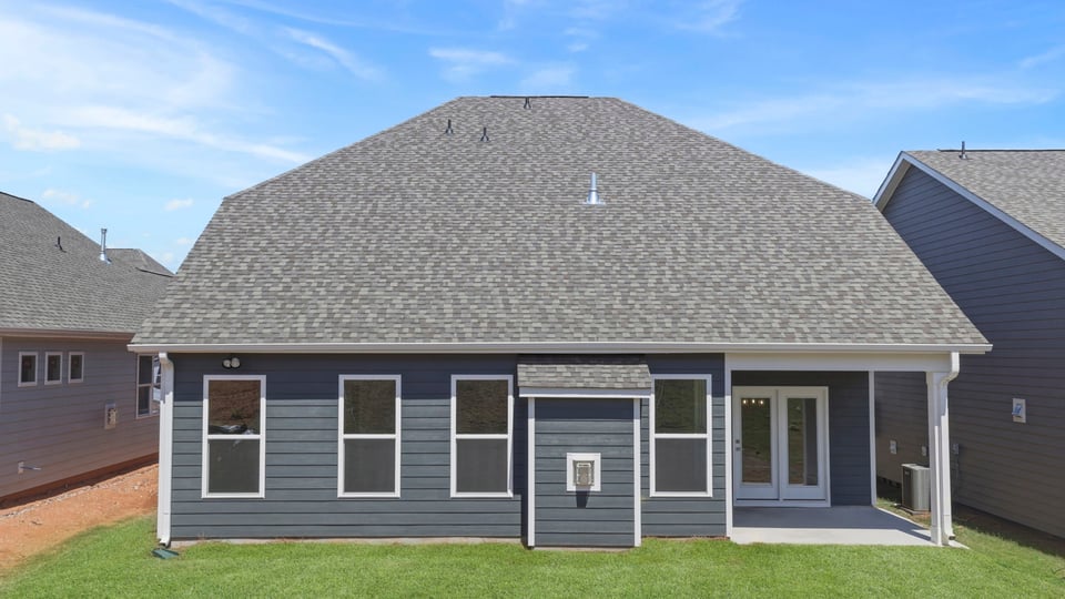Back exterior with large backyard.