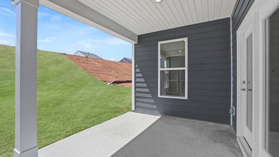 Back exterior with large backyard.