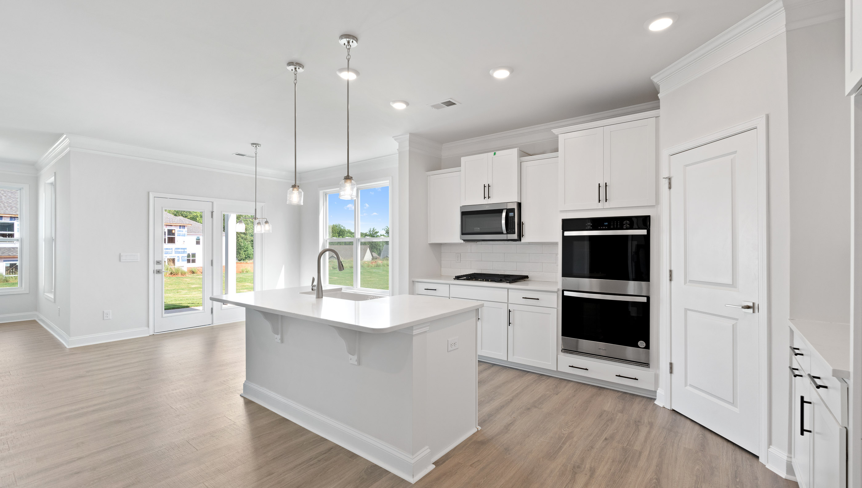 Kitchen open to the breakfast area.