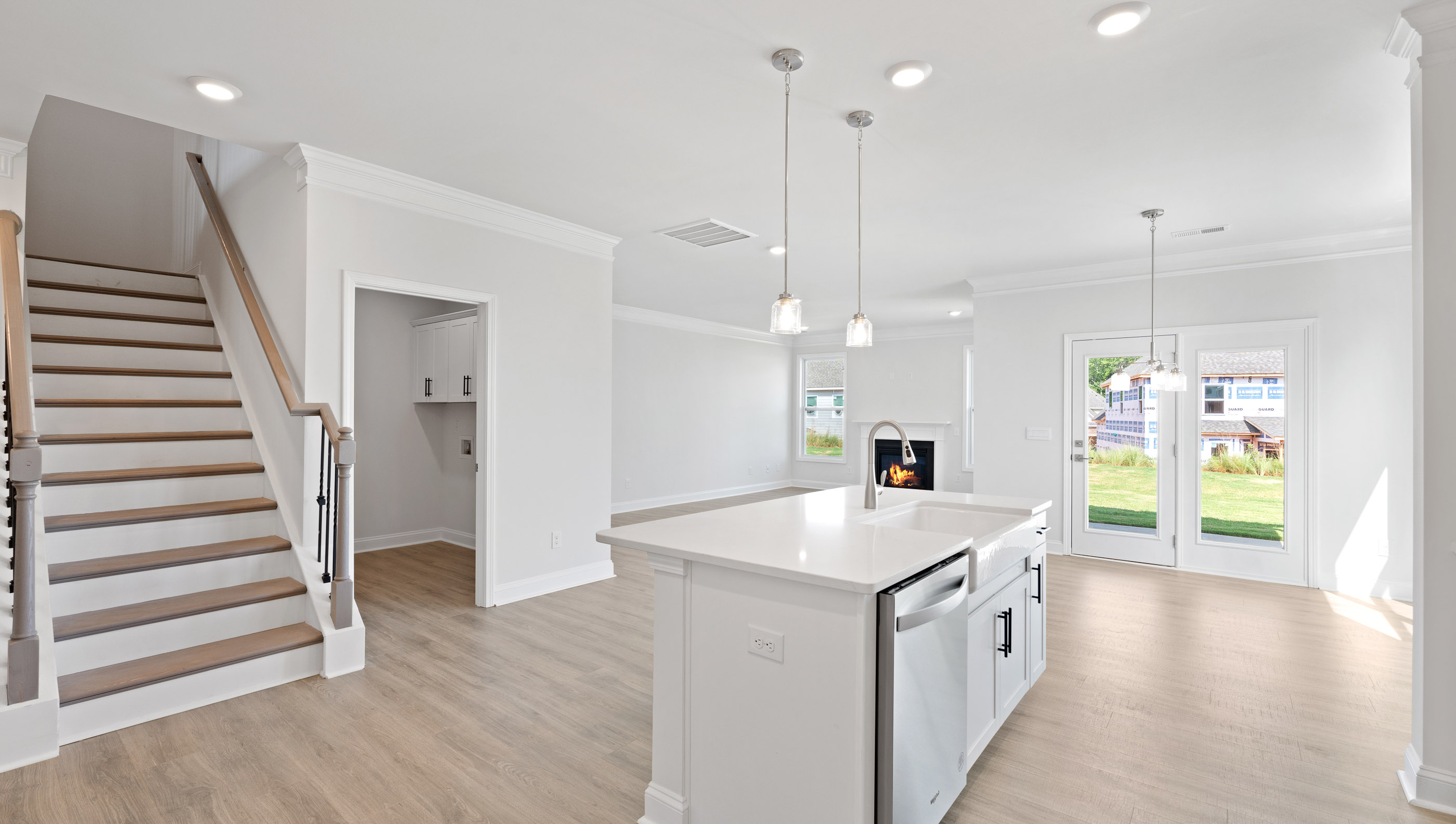 View of kitchen open to the family and dining areass.