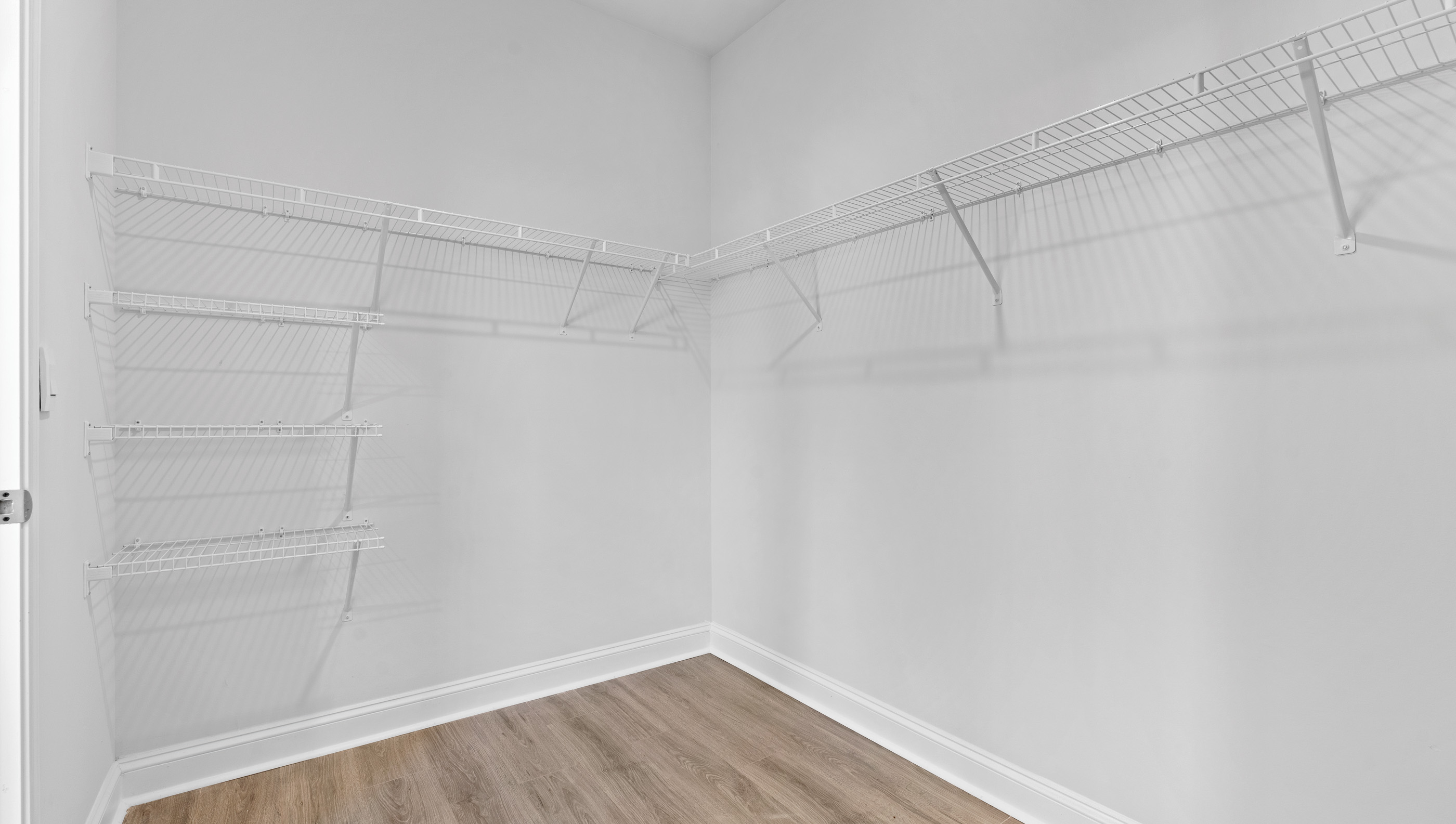 Primary bedroom walk-in closet.