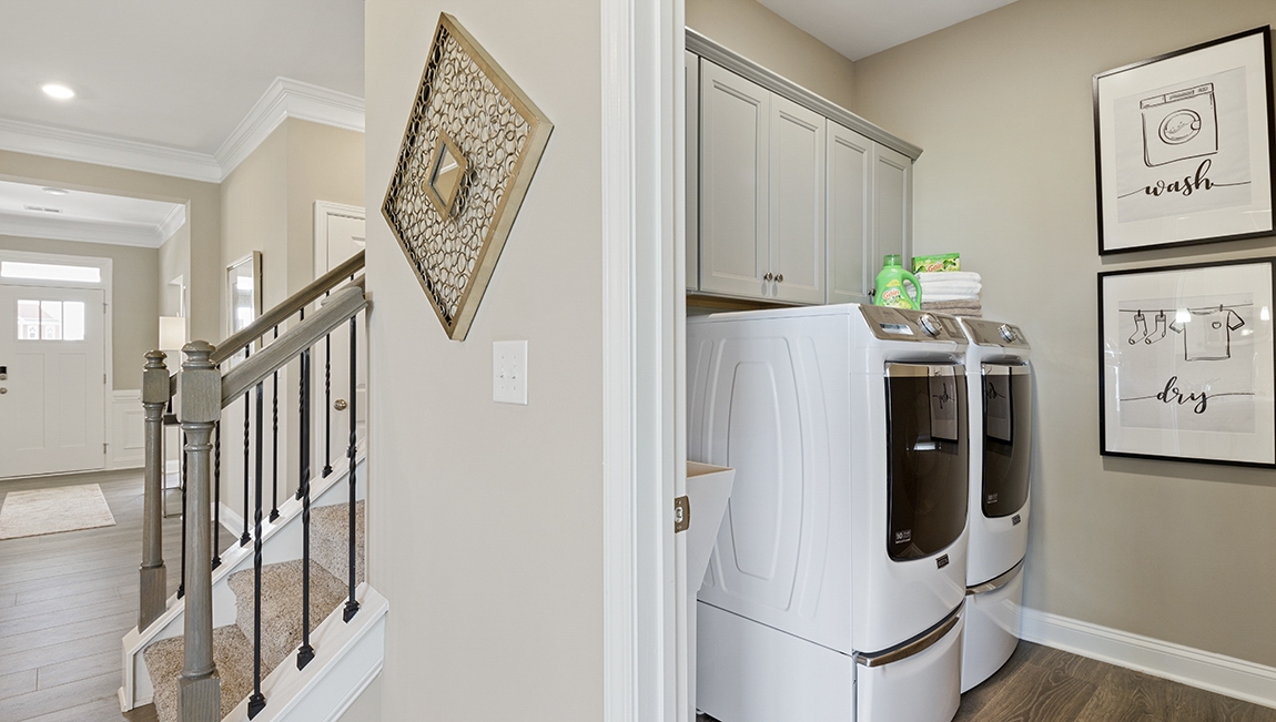 Laundry room with view of hallway.
