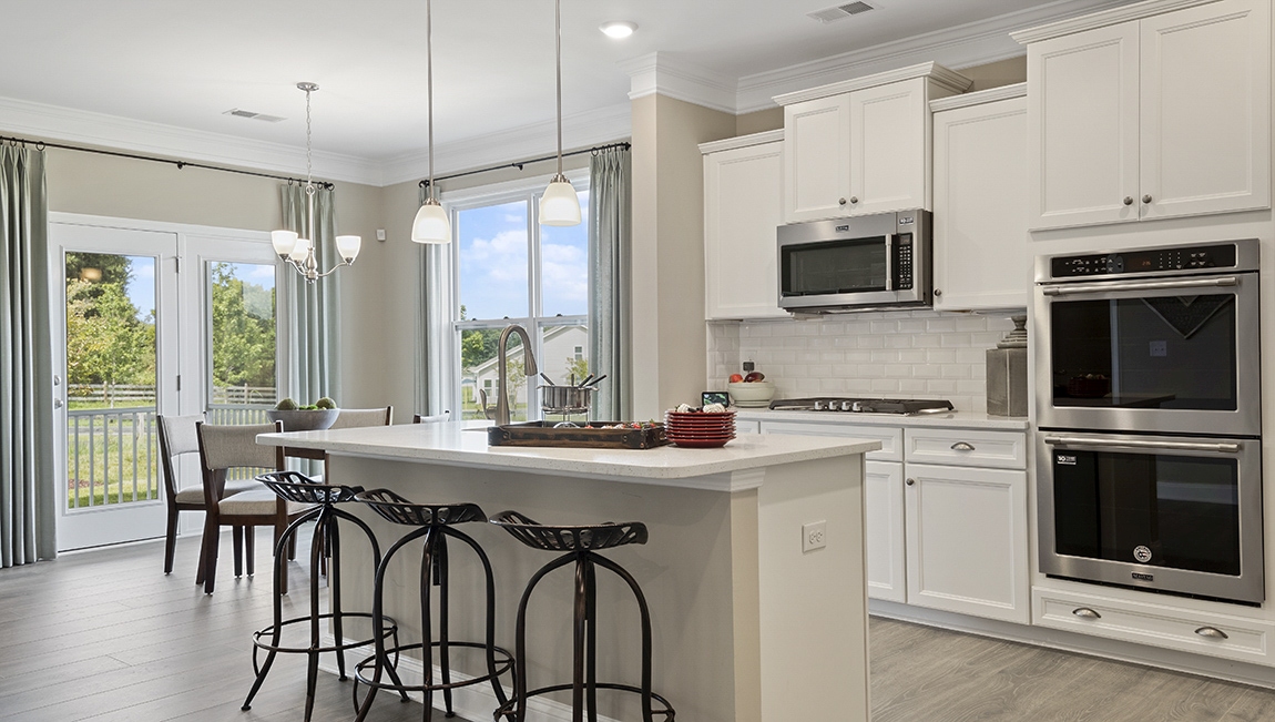 Kitchen and island with granite counter tops.