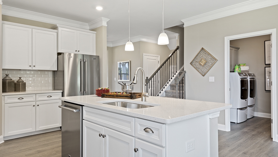 Kitchen and island with granite counter tops.