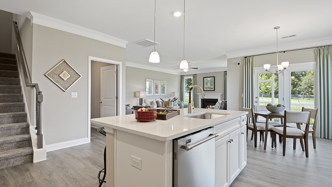 Kitchen and island with white cabinets.