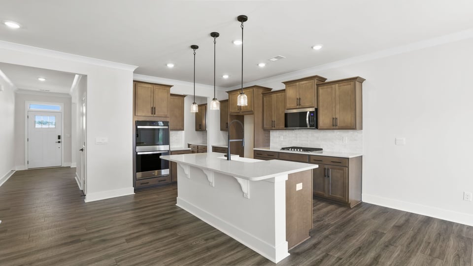 View of the kitchen and hallway toward the entrance.