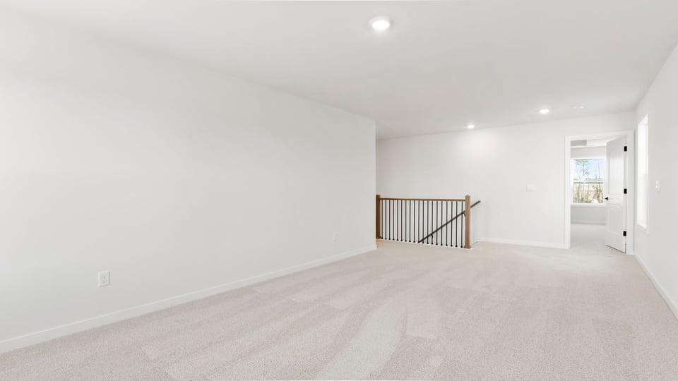 View of recreation room and stairwell.