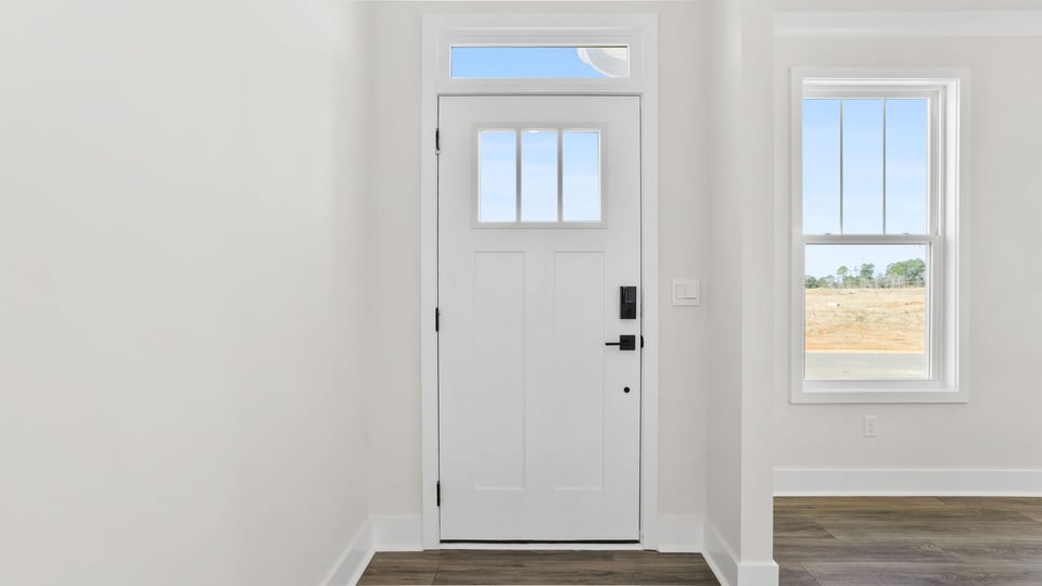 View of entrance and dining room at the front of the home.