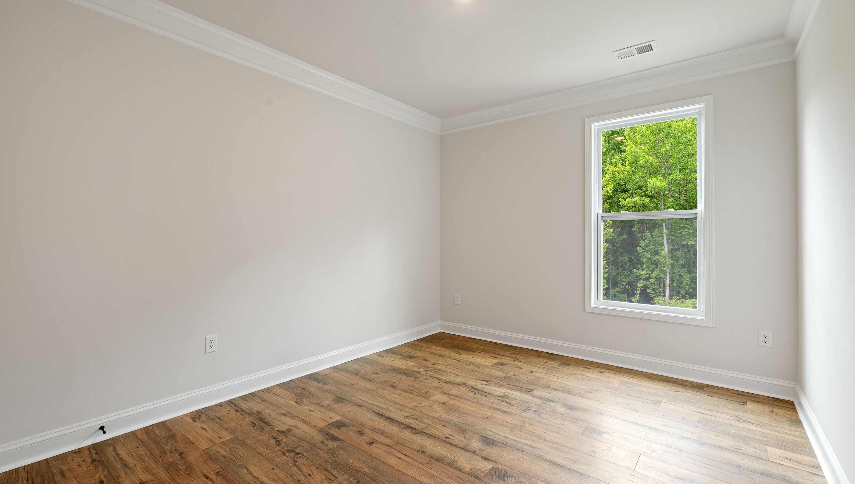 Bedroom with carpet and window..