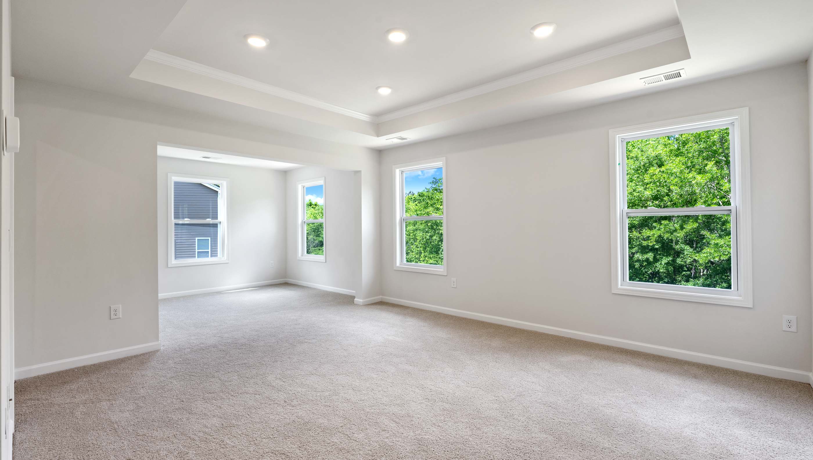 Trey ceiling and recessed lighting in the Primary bedroom.