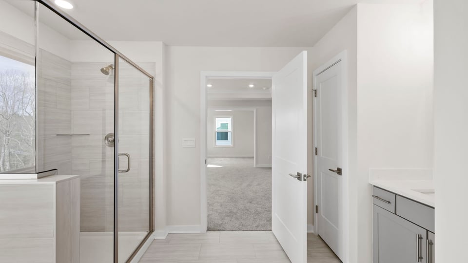 Primary bathroom with double vanity sinks.