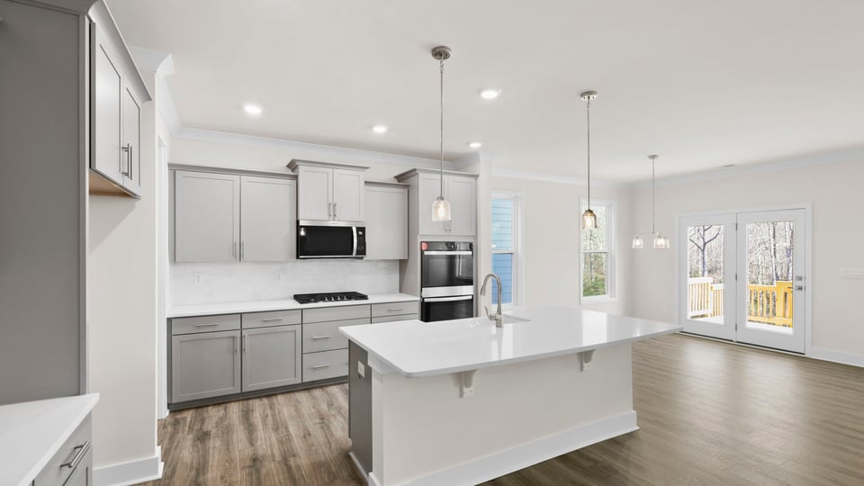 Kitchen with island and cabinets.