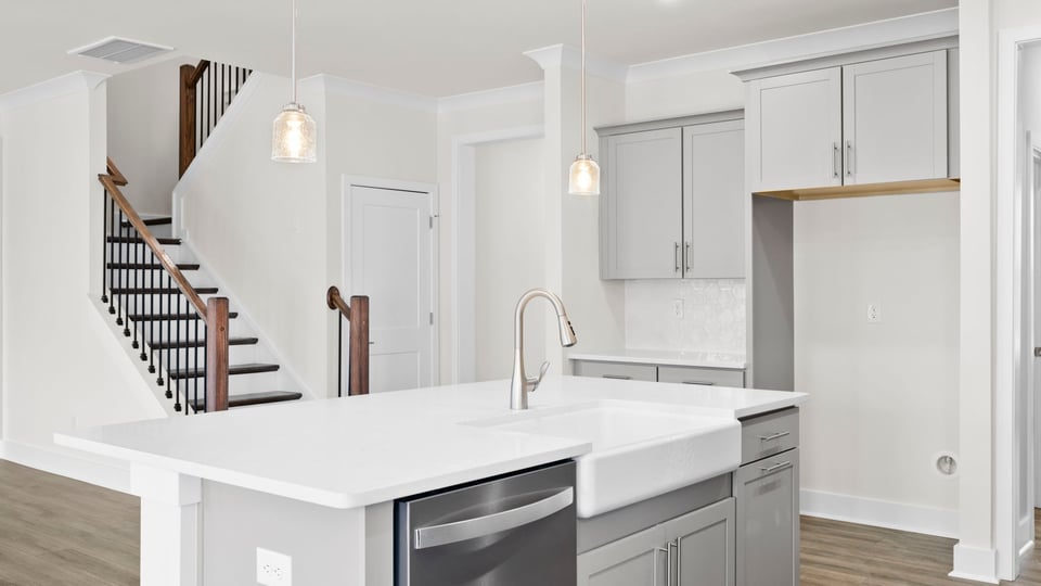 Kitchen with island and cabinets.