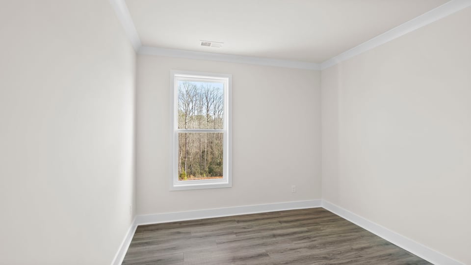 Bedroom with window and closet.