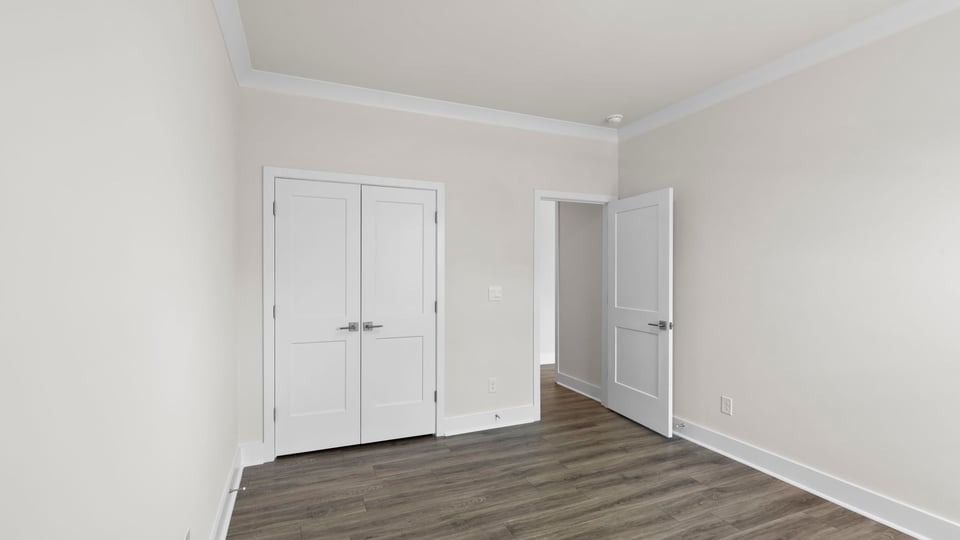 Bedroom with window and closet.