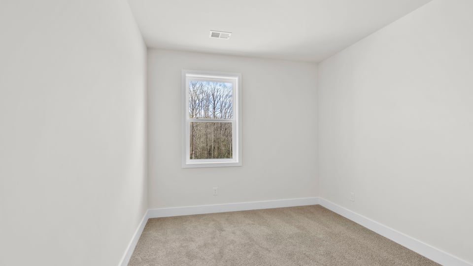 Bedroom with window and closet.