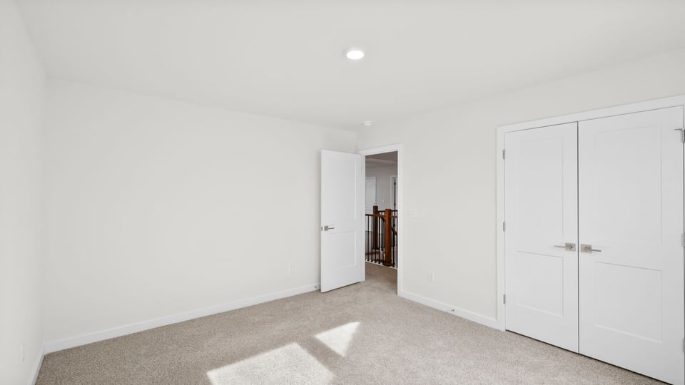 Bedroom with window and closet.