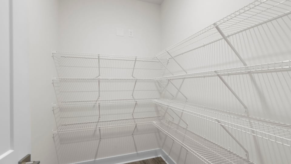 Primary closet with shelf.