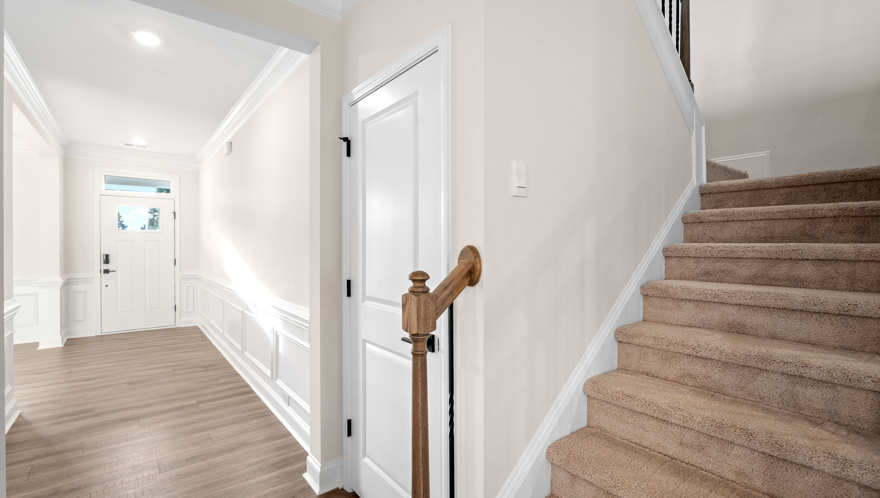 Entry way into home with view of stairs.