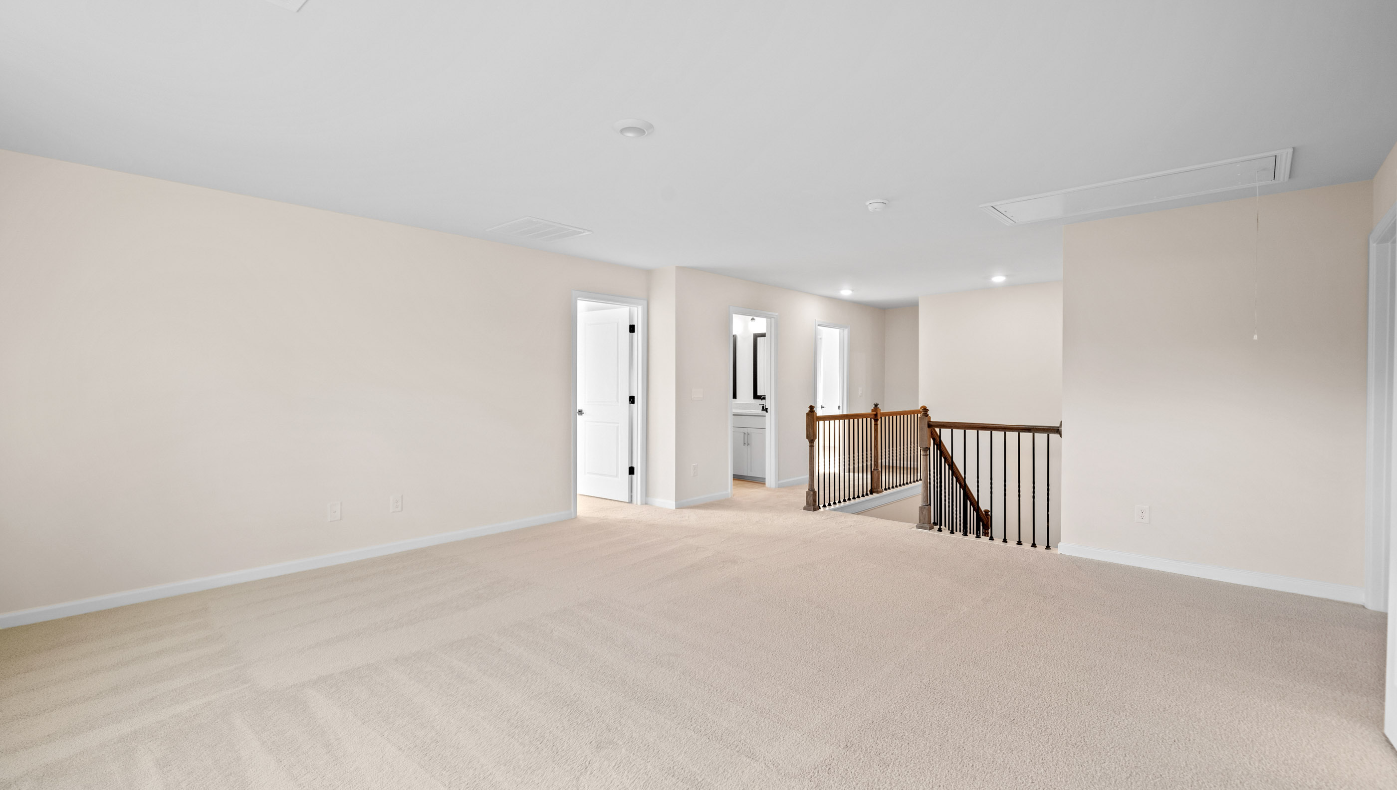Bedroom with carpet and windows.