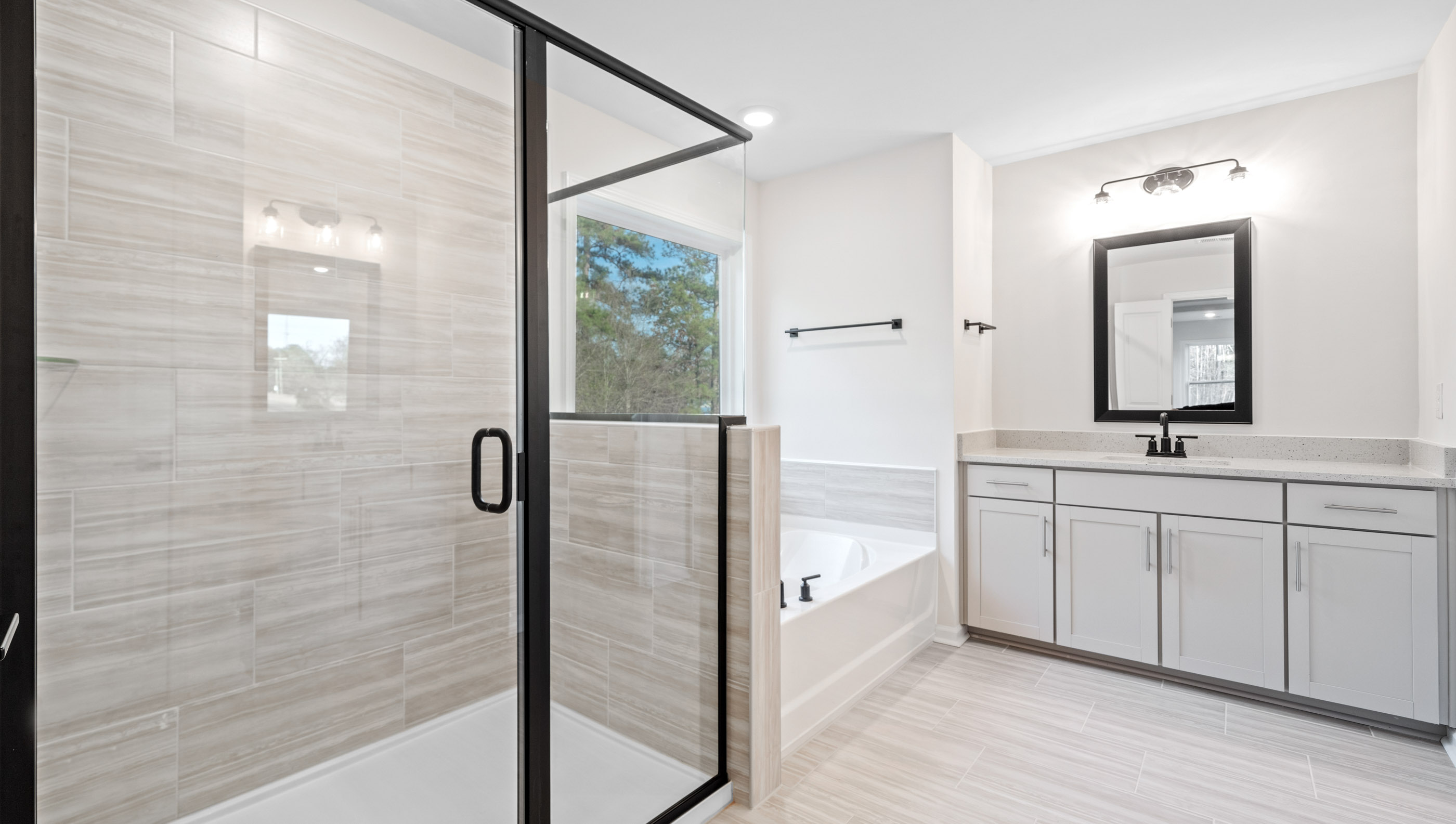 Bathroom with shower and sinks.