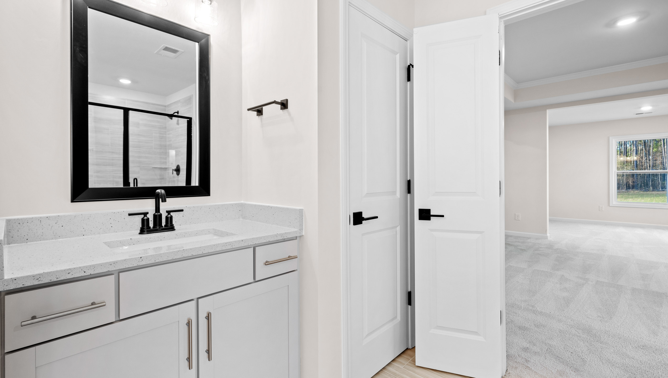 Bathroom with sink and view of room.