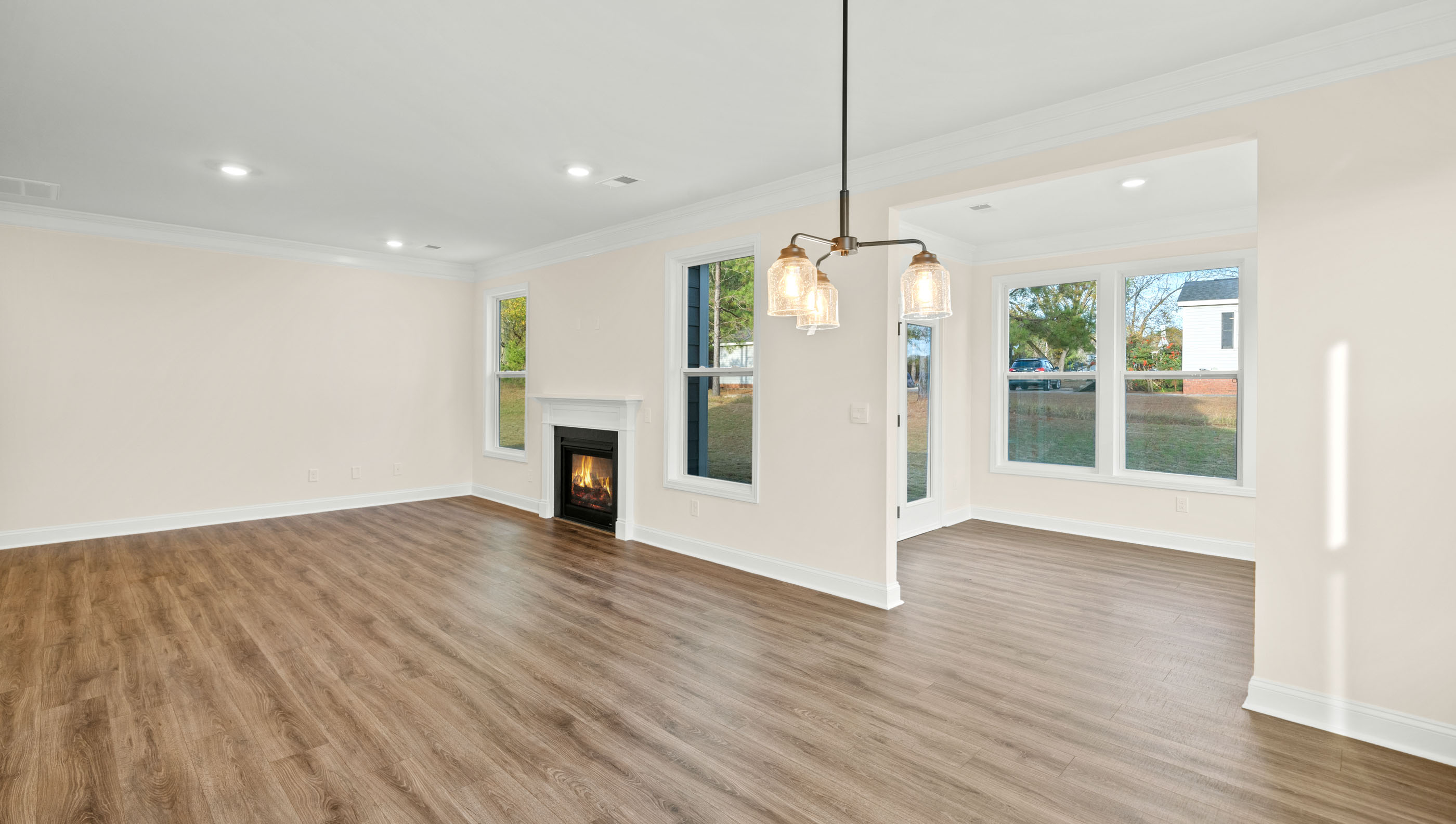 Family room with fireplace and windows.