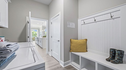 Laundry room with cabinets.