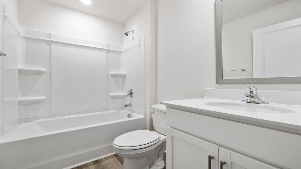 Bathroom with vanity and tub.
