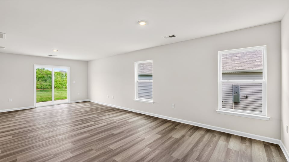 Living area with windows and sliding glass back door