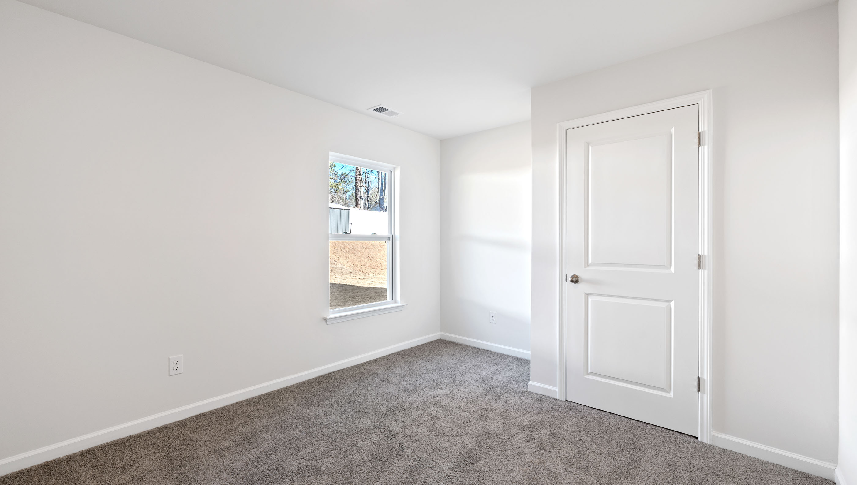 Bedroom with carpet.