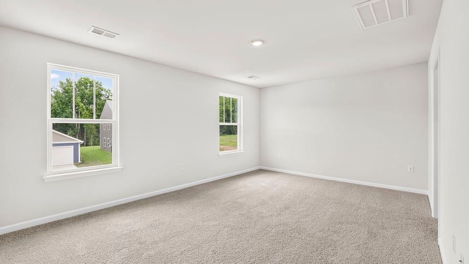Primary bedroom with windows