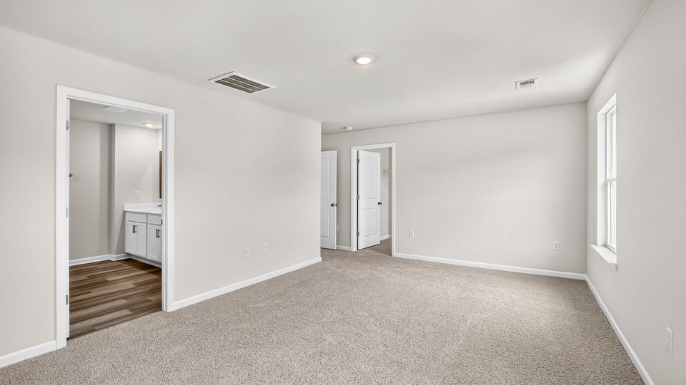 Primary bedroom with closet
