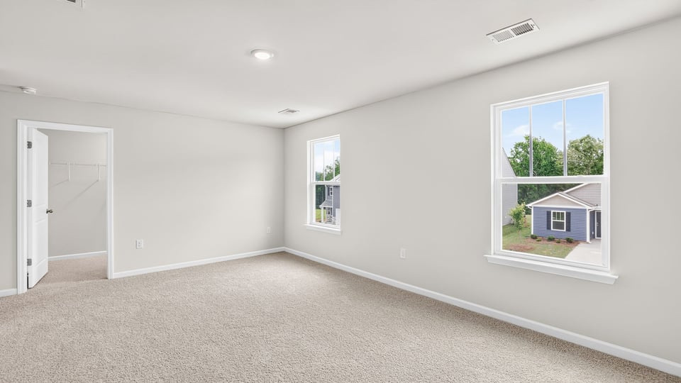 Primary bedroom with windows