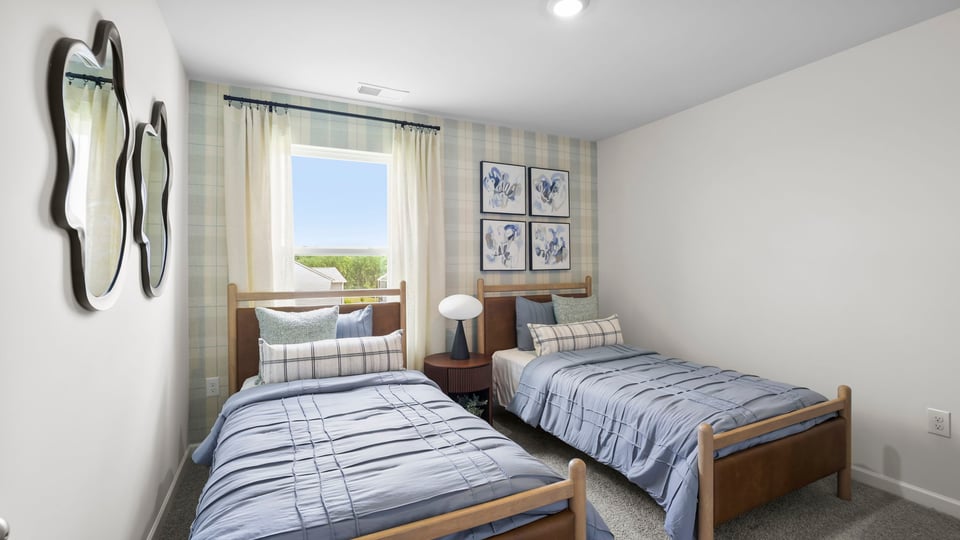 Bedroom with carpet and window.