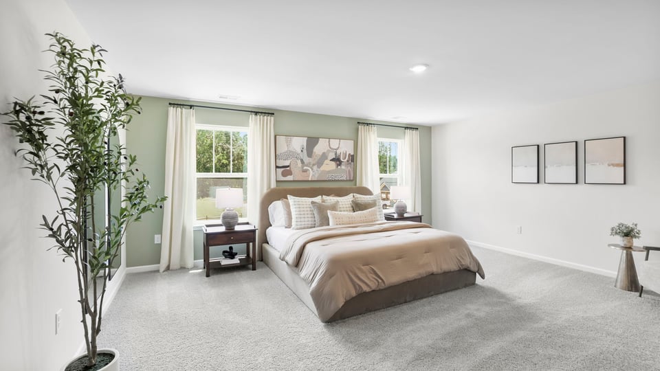 Bedroom with carpet and window.