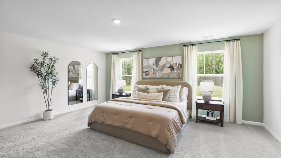 Bedroom with carpet and window.