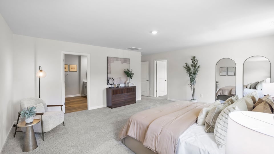 Bedroom with carpet and window.
