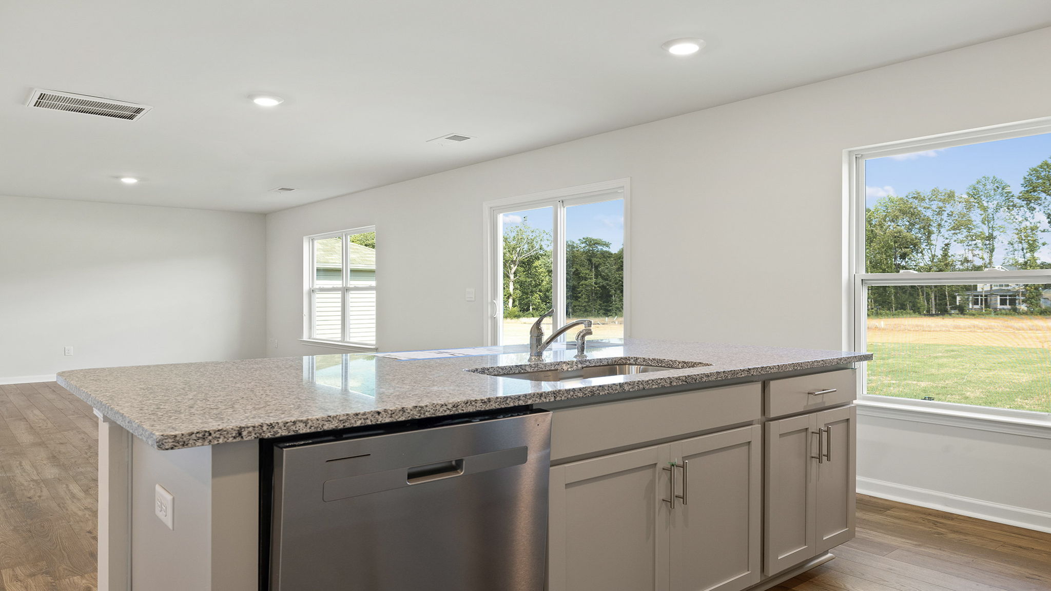 Kitchen and island with granite countertops.
