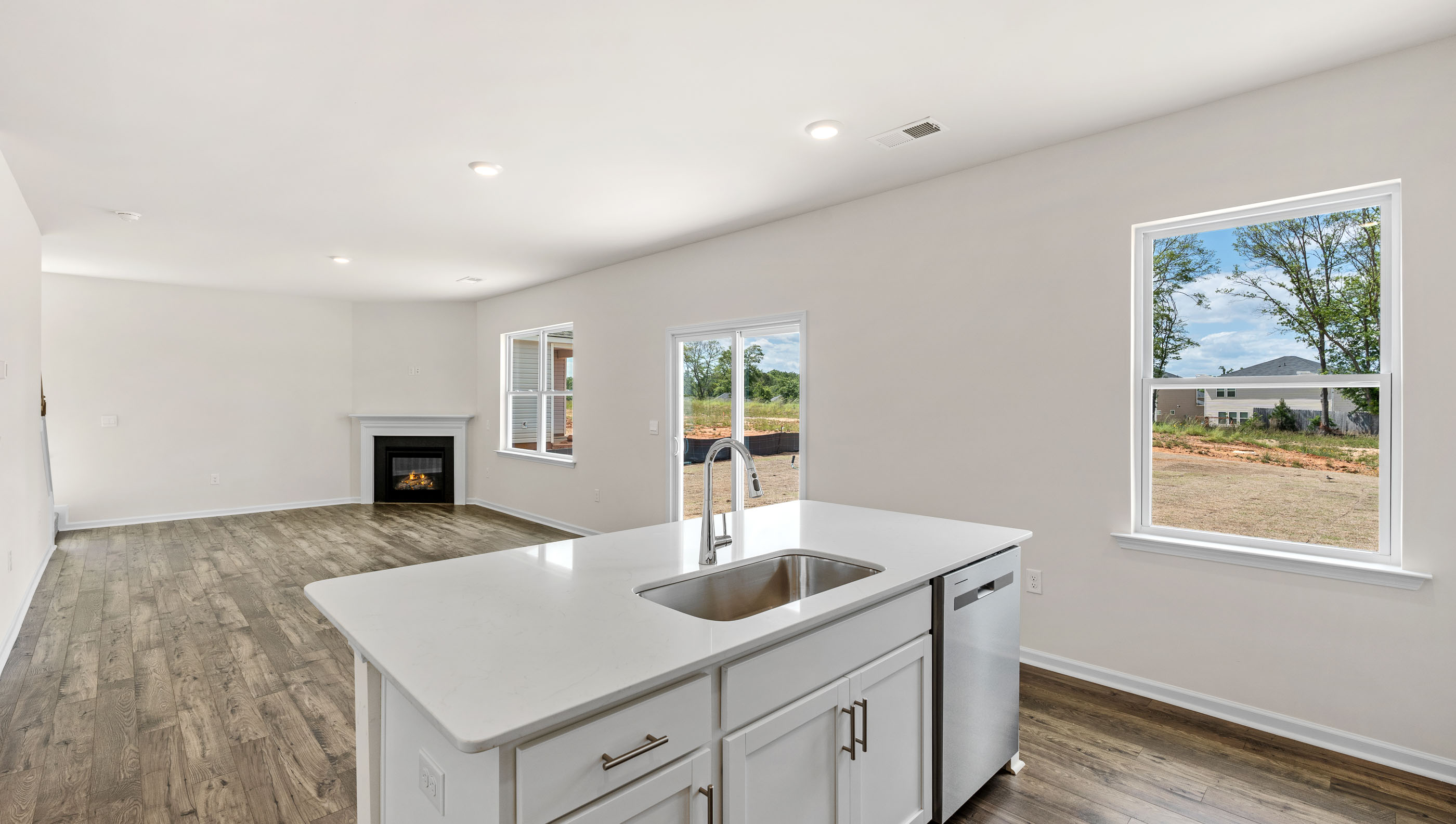 Kitchen and island with granite counter tops.