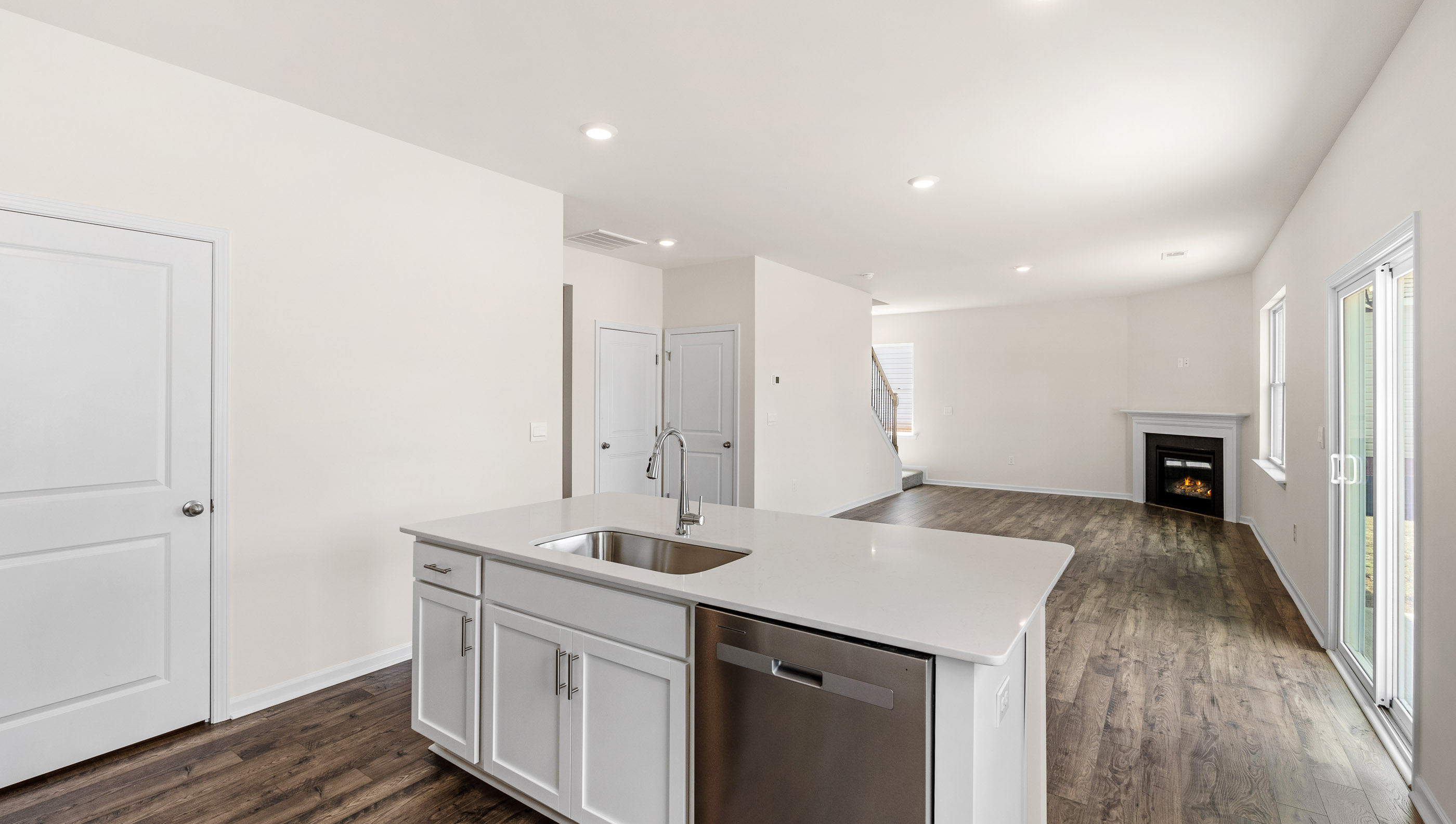Kitchen and island with granite counter tops.