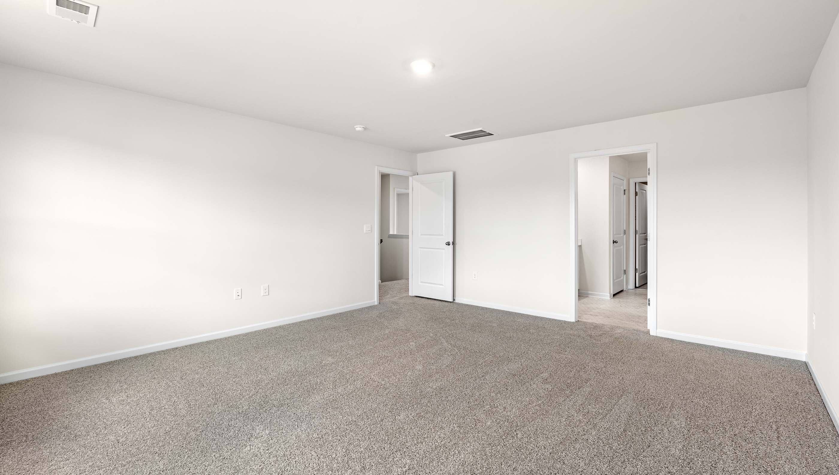 Bedroom with carpet.