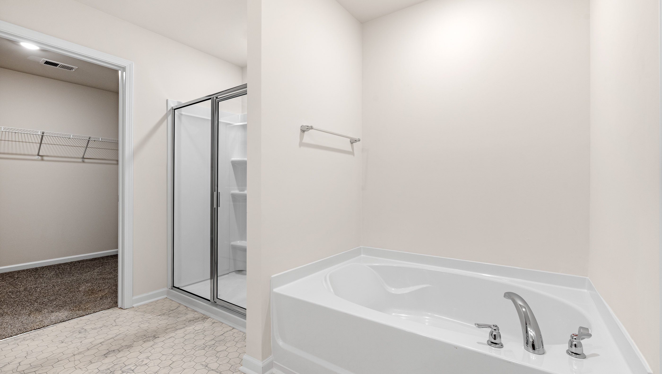 Bathroom with walk in shower and tub.