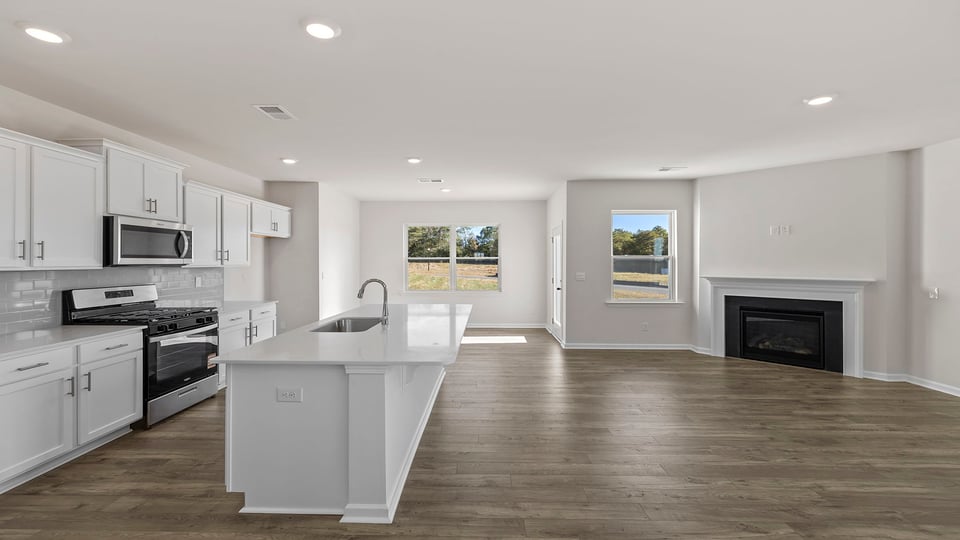 Kitchen and family room with fireplace.