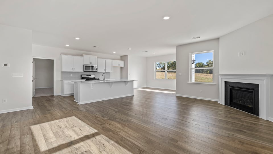 Family room with fireplace and windows.