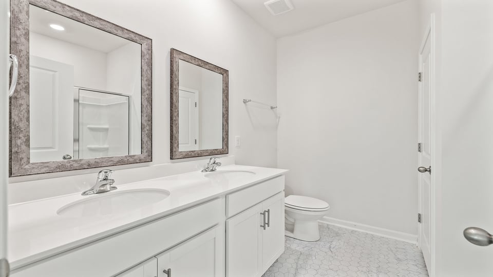 Bathroom with dual vanity.