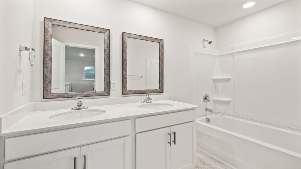 Bathroom with vanity and tub.